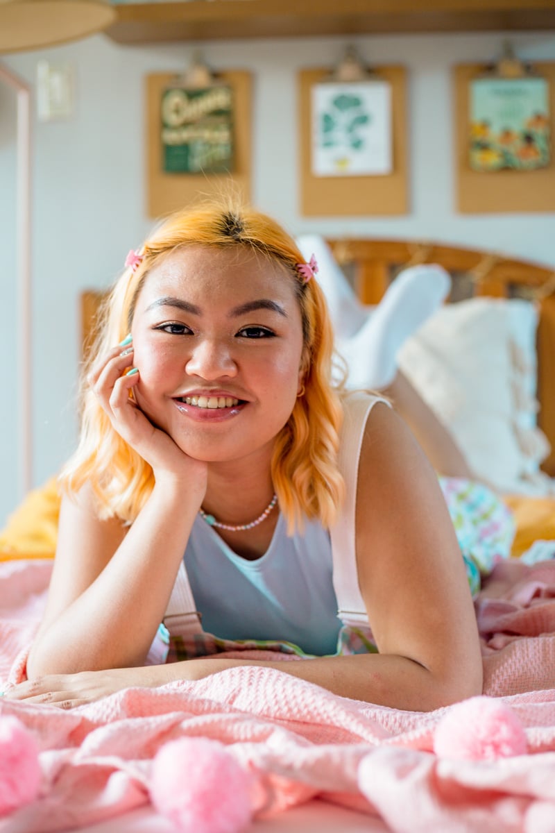 Woman Relaxing in Pastel Bedroom